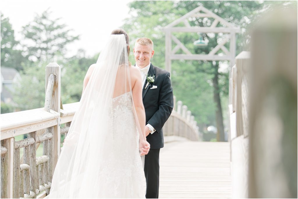 first-look-ny-wedding-photography-on-bridge-trees-in-background